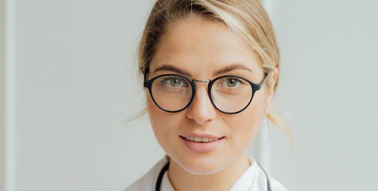 A person wearing glasses and a white shirt

AI-generated content may be incorrect.